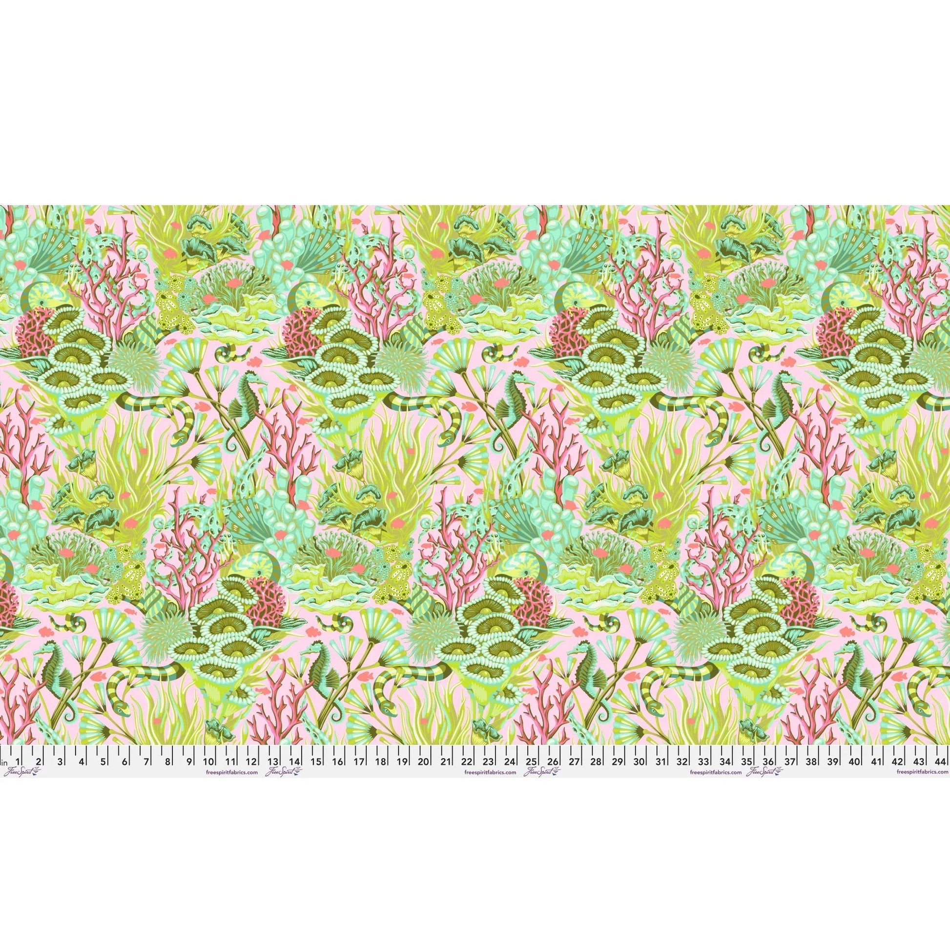 Fabric design of underwater sea life with green, pink, and magenta colors with a ruler at the bottom for scale.