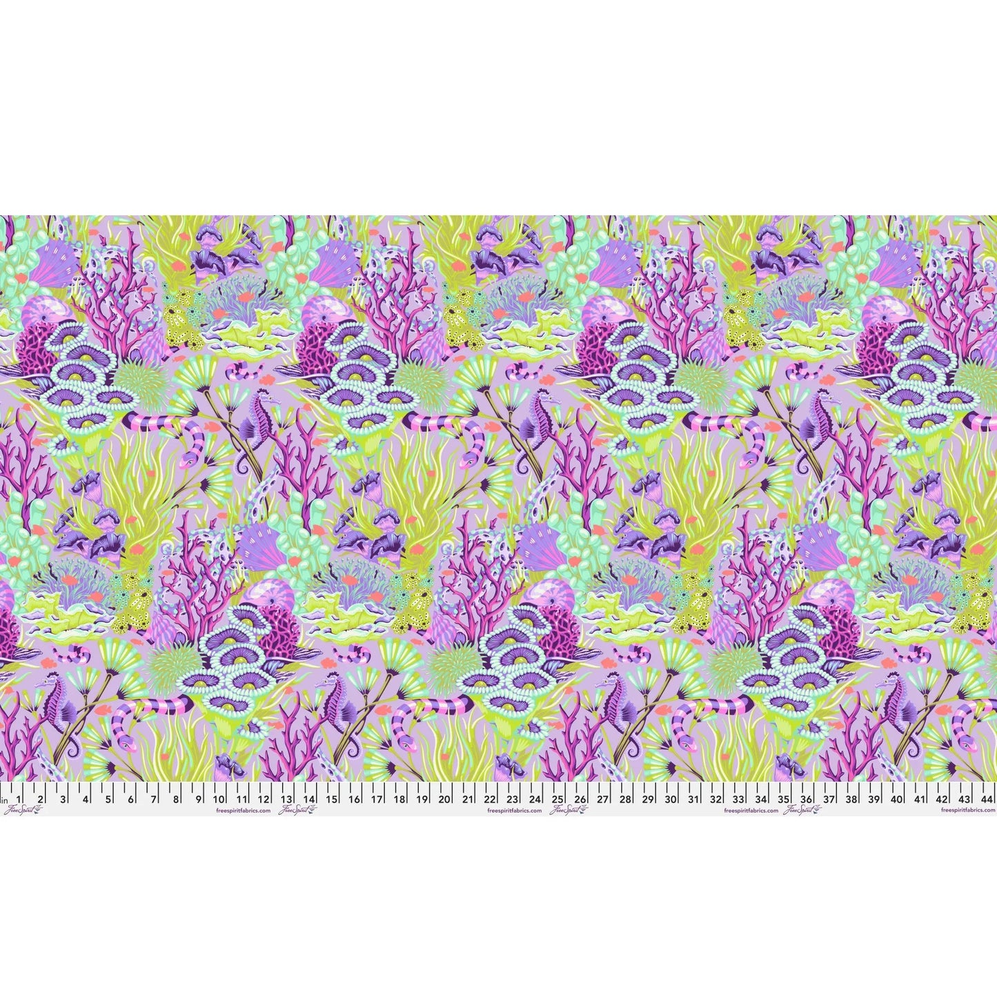 Fabric design of underwater sea life with green, purple, and fuchsia colors with a ruler for scale.