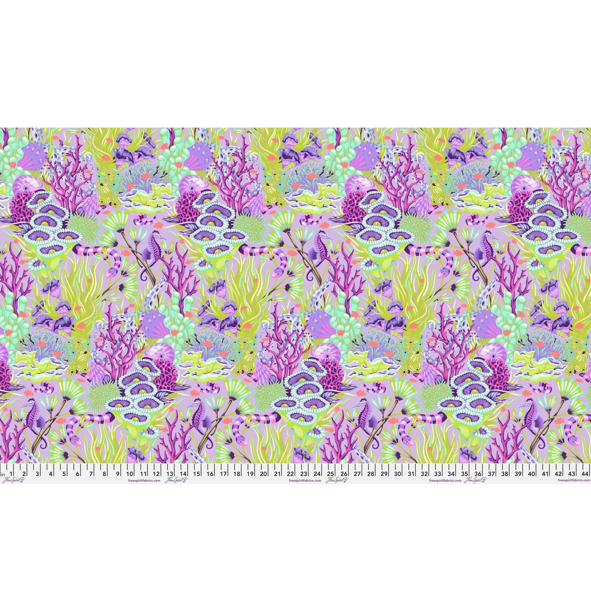 Fabric design of underwater sea life with green, purple, and fuchsia colors with a ruler for scale.