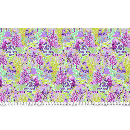 Fabric design of underwater sea life with green, purple, and fuchsia colors with a ruler for scale.