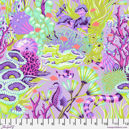 Colorful coral and seahorse pattern on a purple background with a ruler for scale.