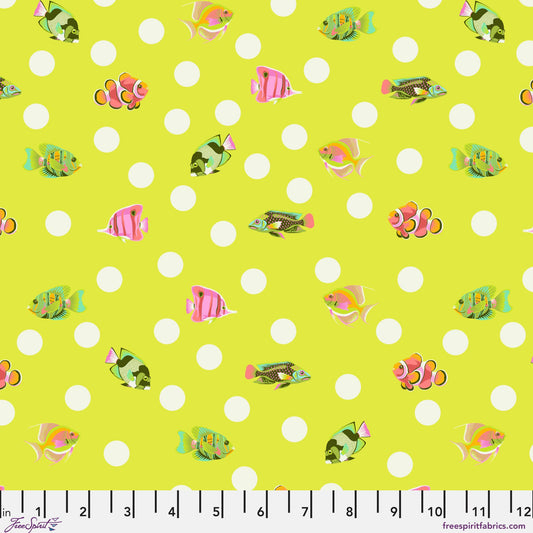 Pattern of colorful fish on a lime green background with white polka dots and a ruler for scale.