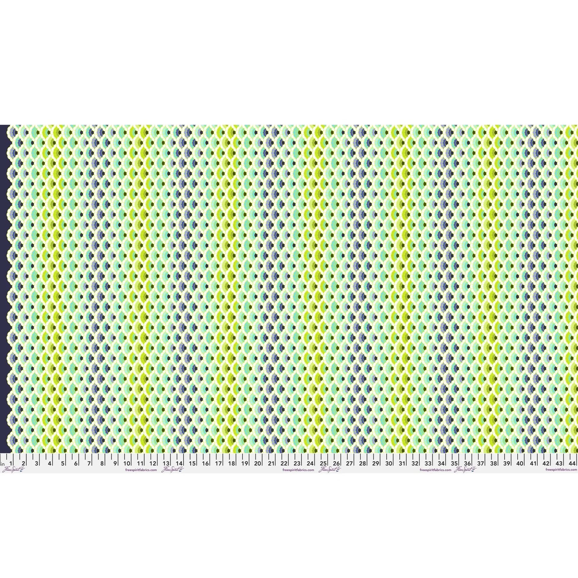 Geometric pattern of overlapping scalloped shapes with green, blue, navy, and turquoise colors on a dark background. Ruler at the bottom for scale.