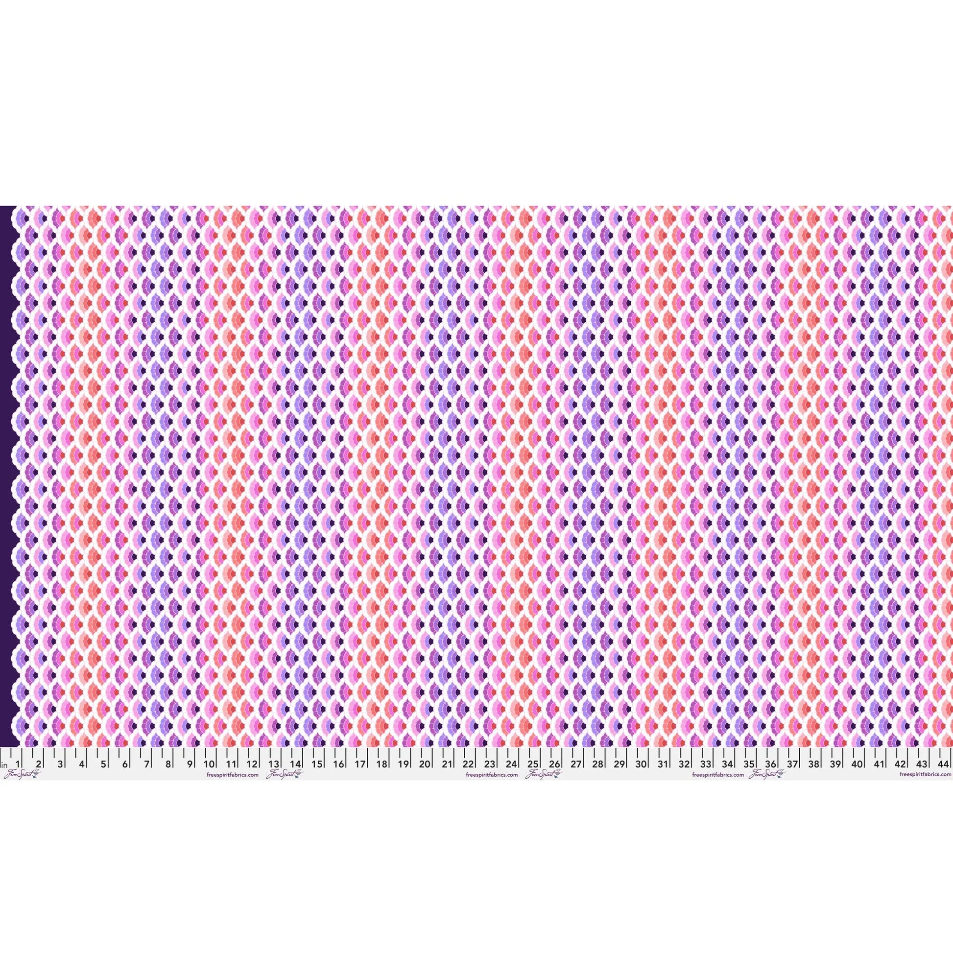 Geometric pattern of overlapping scalloped shapes with pink, coral, red, and purple colors on a dark background with a ruler for scale.