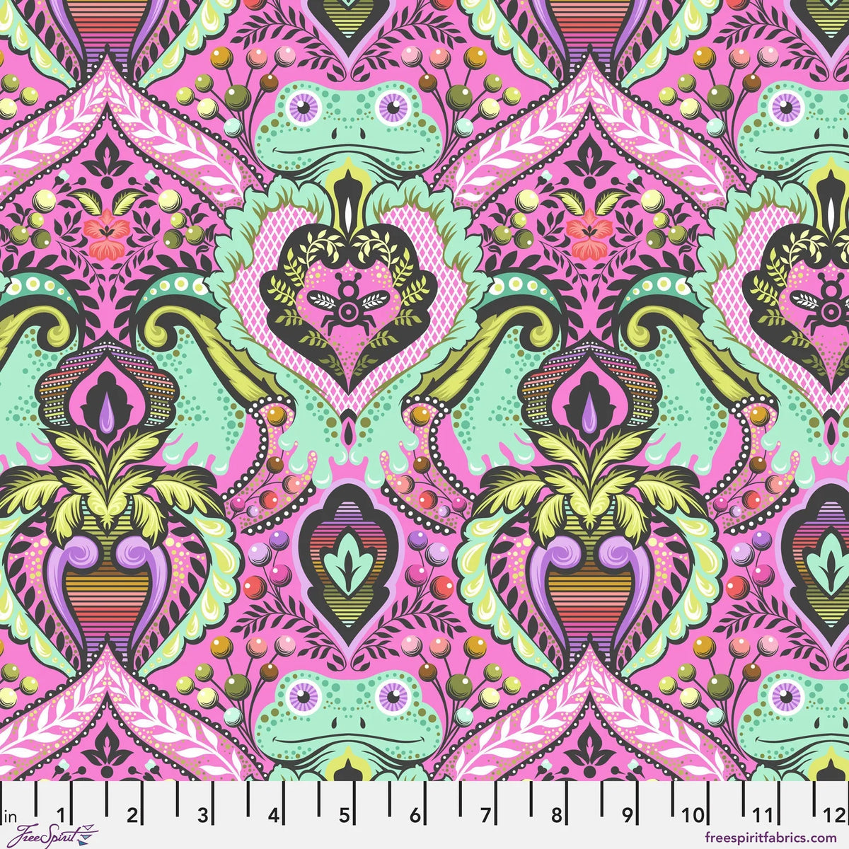 A vibrant hot pink fabric pattern featuring mint green frogs nestled into an ornate pink, purple, and olive green damask floral design. Ruler at the bottom for scale.