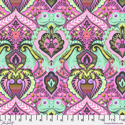 A vibrant hot pink fabric pattern featuring mint green frogs nestled into an ornate pink, purple, and olive green damask floral design. Ruler at the bottom for scale.