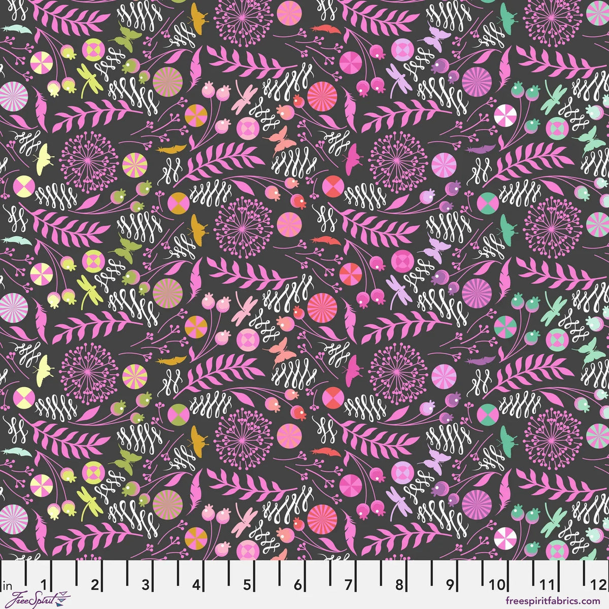A seamless botanical pattern featuring stylized flowers, leaves, butterflies, feathers, and pinwheels in pink, purple, orange, yellow, and white on a dark charcoal black background. Ruler at the bottom for scale.