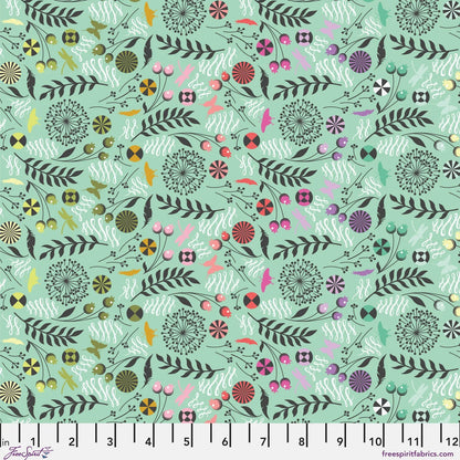 A seamless botanical fabric pattern featuring stylized leaves, flowers, butterflies, feathers, and flourishes in a variety of colors on a light mint green background. Ruler at the bottom for scale.