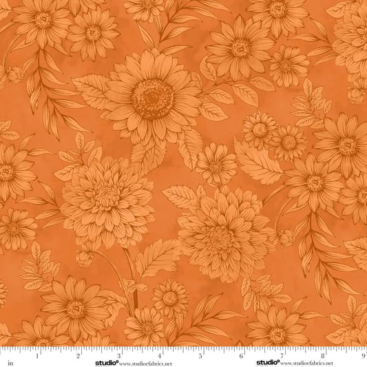 Floral pattern with sunflowers on an orange background with a ruler for scale.