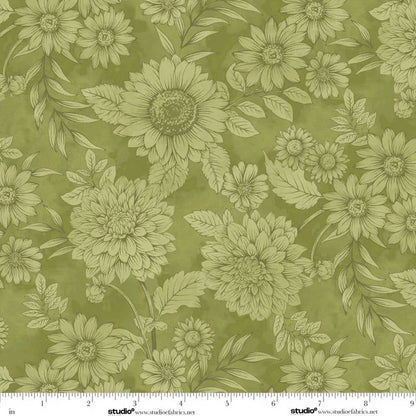 Floral pattern with green flowers and leaves on a green background with a ruler for scale. 