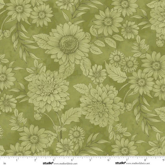 Floral pattern with green flowers and leaves on a green background with a ruler for scale. 