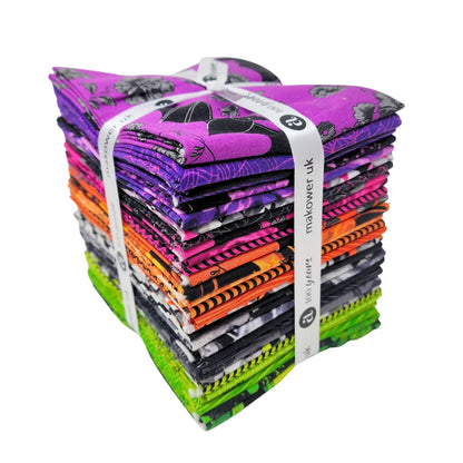 A bundle of 30 fat quarters in shades of purple, pink, orange, black, and green tied with a white ribbon.