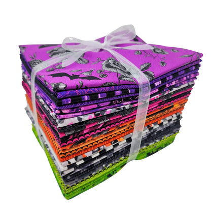 A bundle of 30 half-yard cuts of fabric in shades of purple, pink, orange, black, and green tied with a white ribbon.