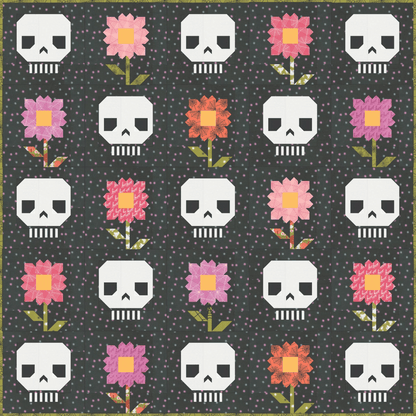 Pushing Up Daisies Quilt features alternating blocks of patchwork flowers and skulls.