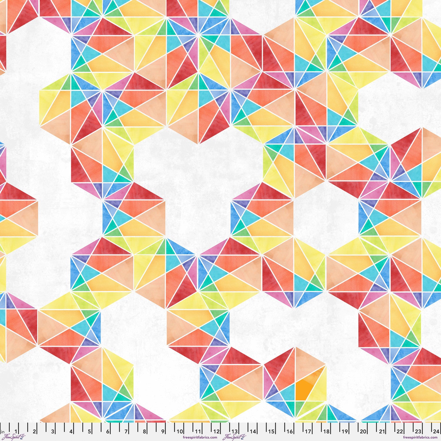 Fabric with a bold, graphic pattern of hexagons subdivided into vivid, multicolored triangles. Ruler at the bottom for scale.