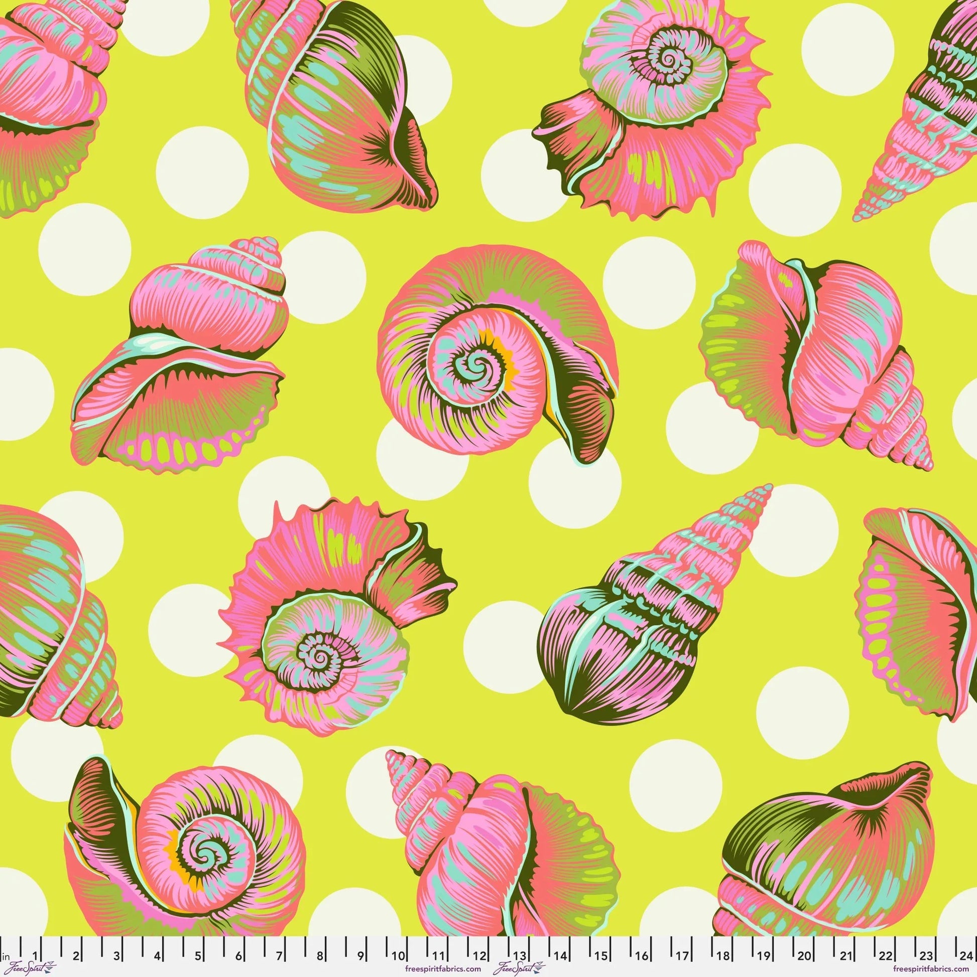 Colorful detailed shell pattern on a lime green background with white polka dots. Ruler at the bottom for scale.