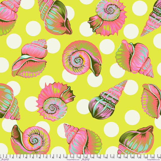 Colorful detailed shell pattern on a lime green background with white polka dots. Ruler at the bottom for scale.