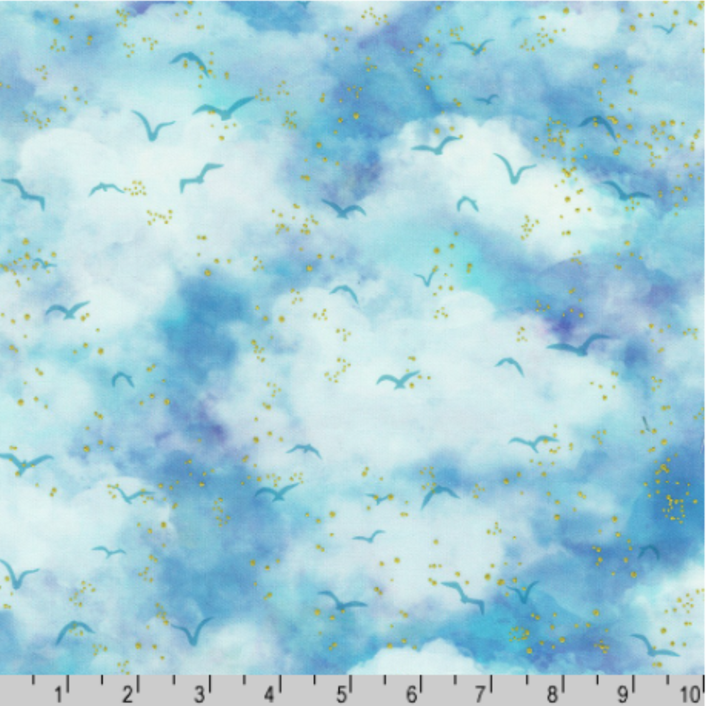 An airy watercolor sky print in soft blues and aquas, dotted with gentle bird silhouettes and subtle gold accents. Ruler for scale