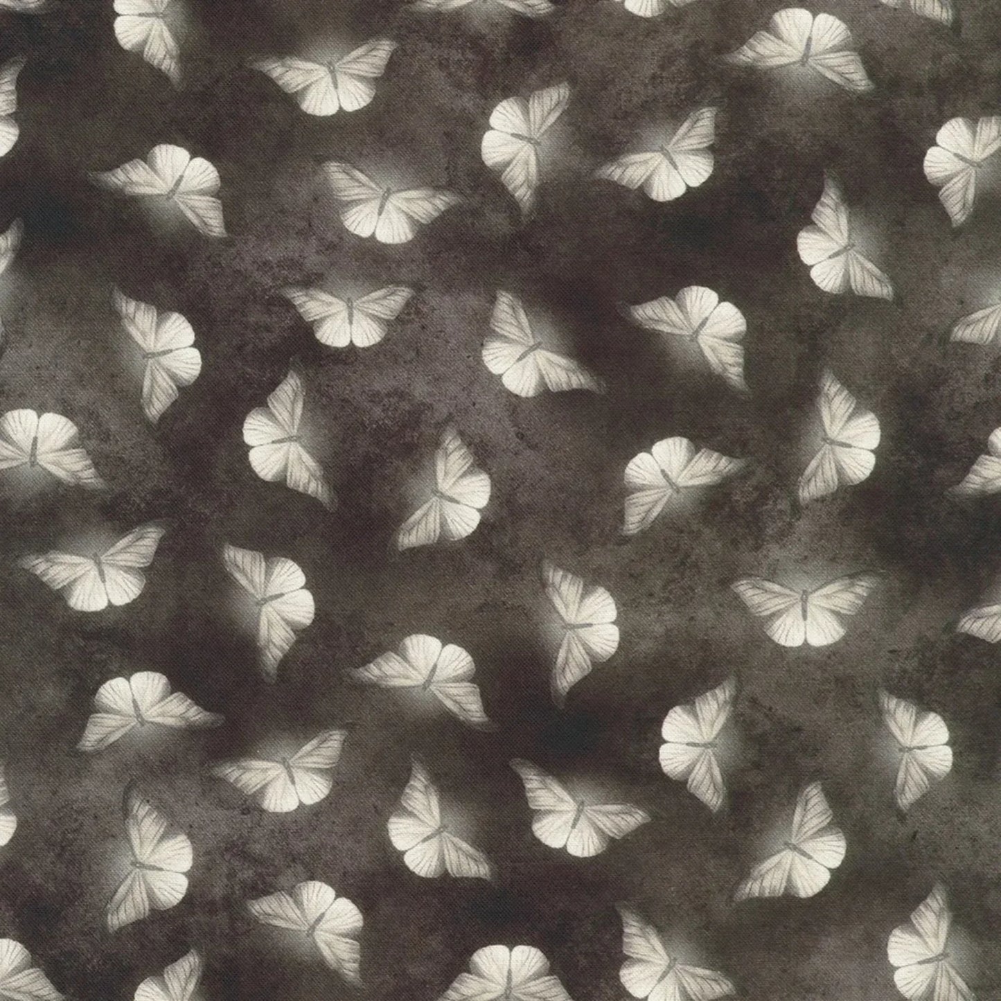 Patterned fabric of softly glowing white moth silhouettes scattered across a dark, mottled charcoal grey background.