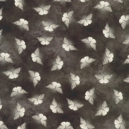 Patterned fabric of softly glowing white moth silhouettes scattered across a dark, mottled charcoal grey background.