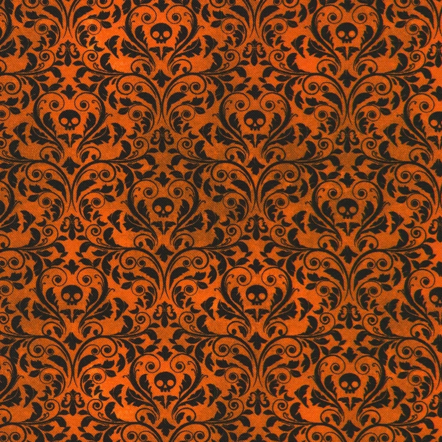 An ornate black damask pattern with small skull motifs on a warm, burnt-orange background. 