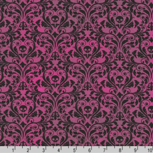 An ornate black damask pattern with small skull motifs on a rich, plum background with a ruler at the bottom for scale. 
