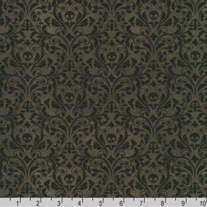 An ornate black damask pattern with small skull motifs on a charcoal-black background with a ruler at the bottom for scale.