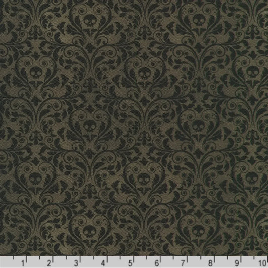 An ornate black damask pattern with small skull motifs on a charcoal-black background with a ruler at the bottom for scale.
