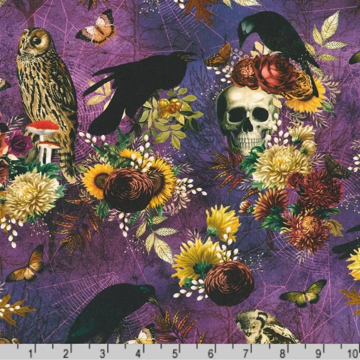 Purple gothic fabric with a detailed print featuring a skull, owl, crows, sunflowers, roses, moths, mushrooms, and leaves, with a ruler at the bottom for scale.