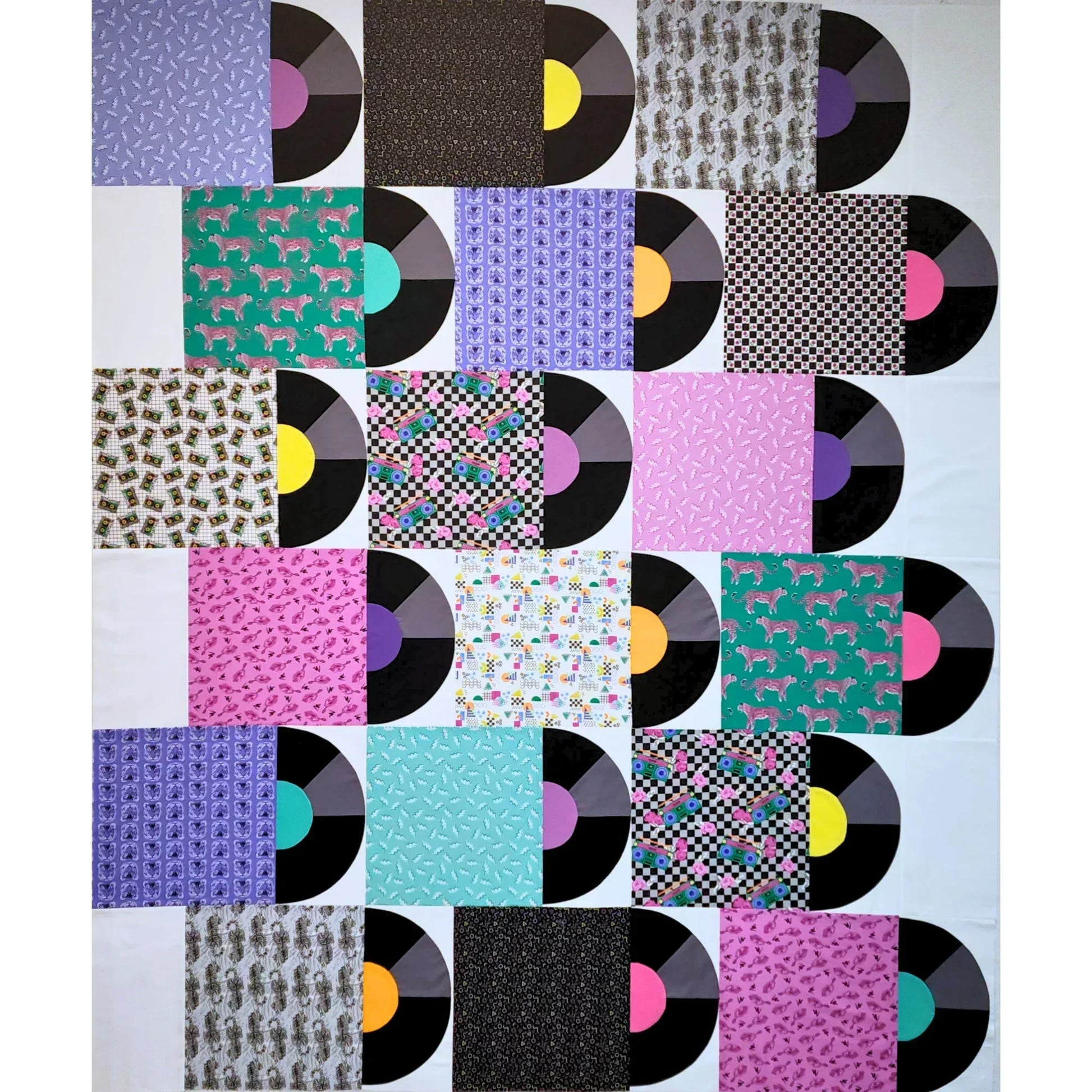 Patchwork quilt with vinyl record design on a white background