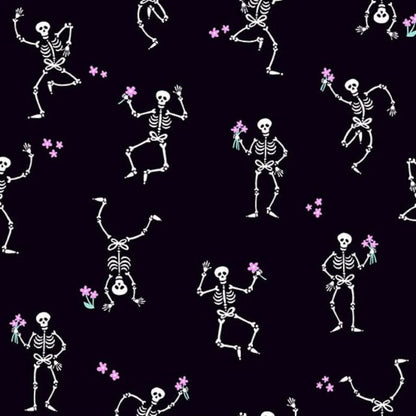 Pattern of dancing white skeletons with flowers on a black background