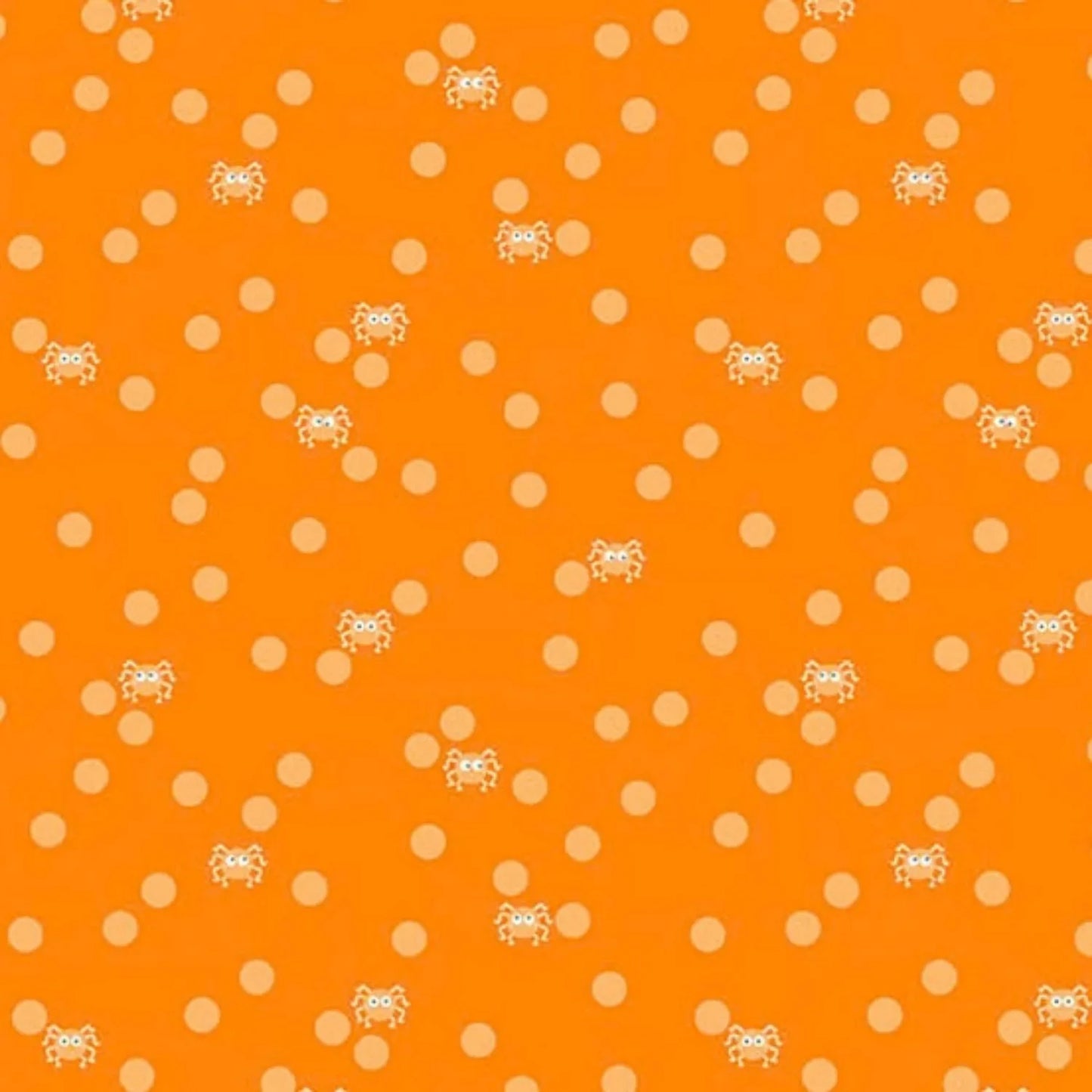 Orange fabric with peach polka dots and small cartoon spiders