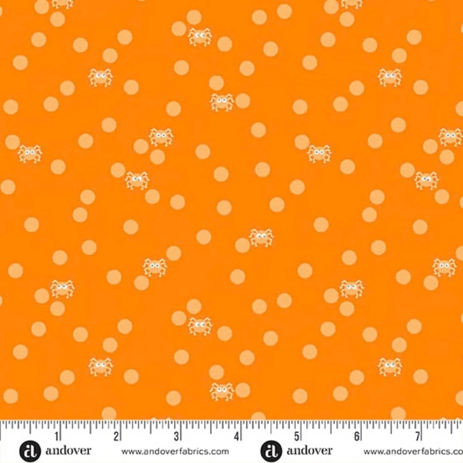 Orange fabric with peach polka dots and small cartoon spiders with a ruler for scale