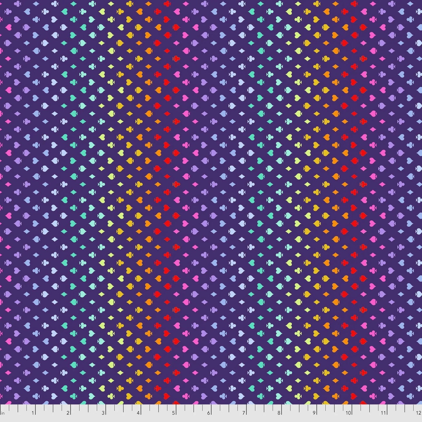 Colorful pattern of small card suite symbols on an indigo-purple background with a ruler for scale.