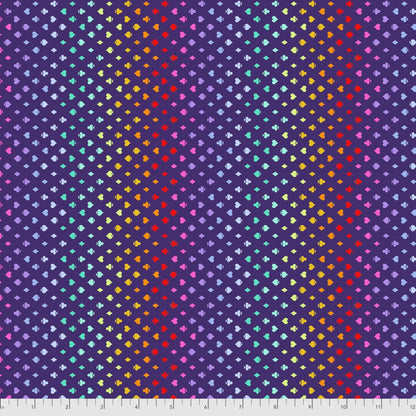 Colorful pattern of small card suite symbols on an indigo-purple background with a ruler for scale.