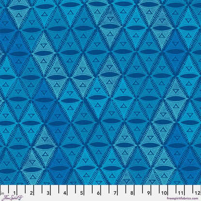 Repeating, triangular motif rendered in aqua, navy, and soft turquoise with a ruler for scale.