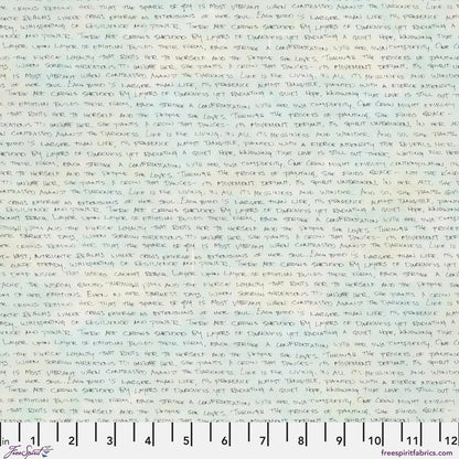 Handwritten text in black ink on a subtly blended white and blue-grey background. Ruler for scale.