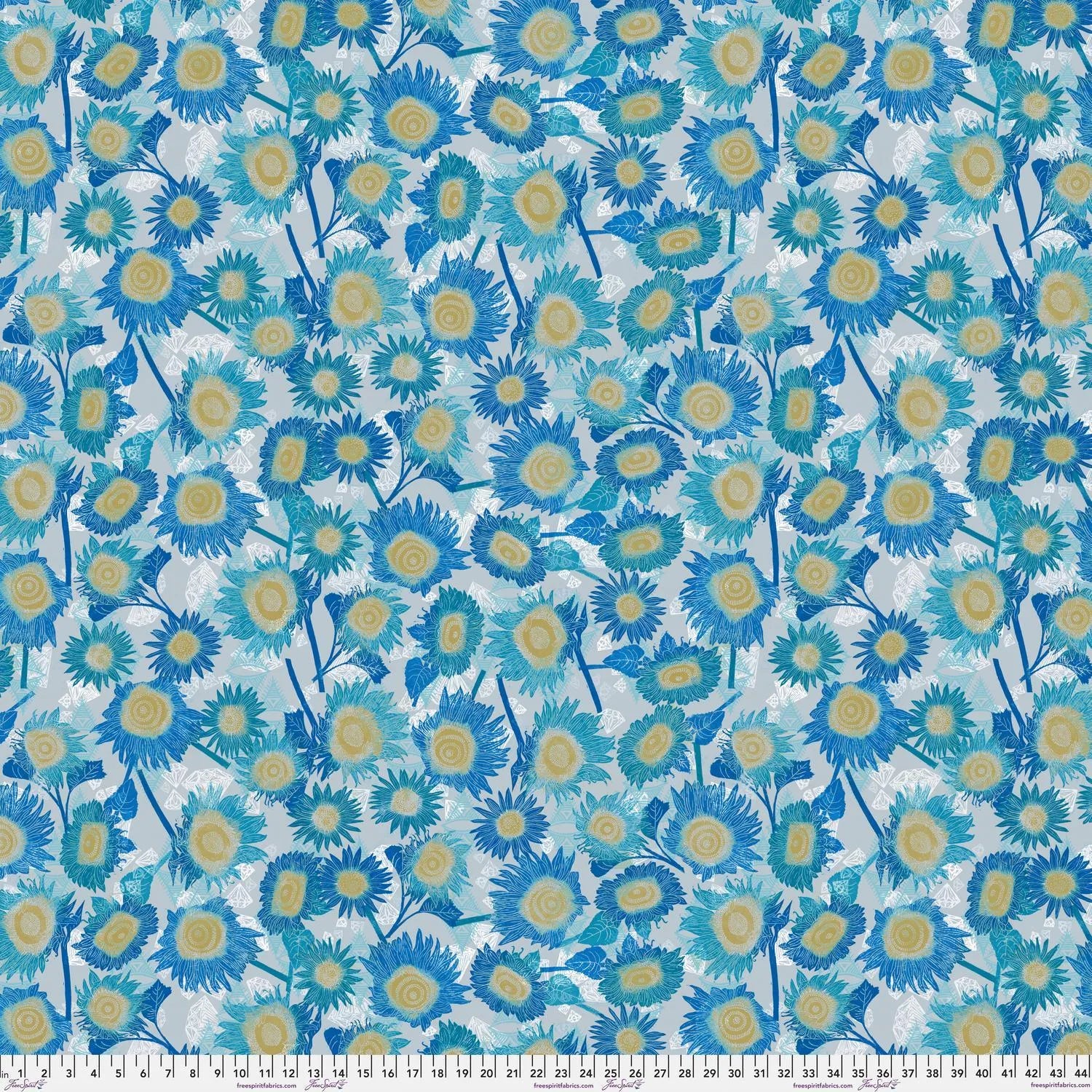 Pattern of blue and yellow flowers on a light blue background with a ruler at the bottom for scale.