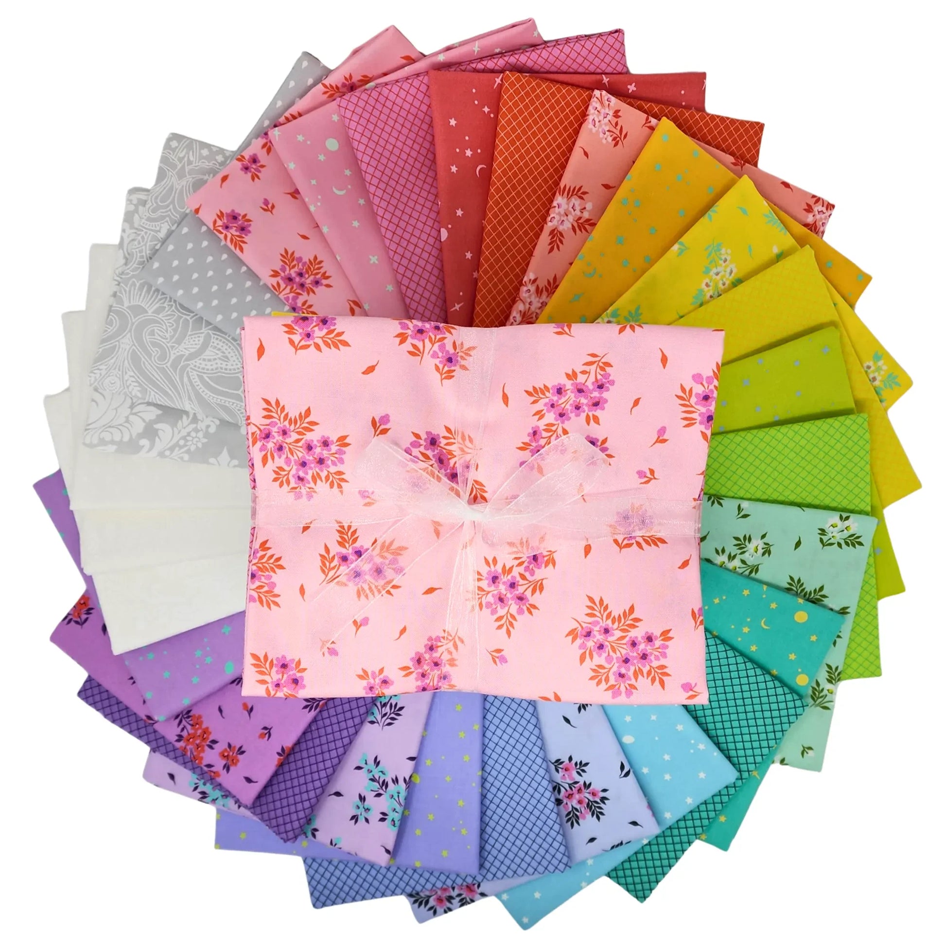 Colorful fabric swatches are arranged in a circular pattern with a half-yard bundle in the center.