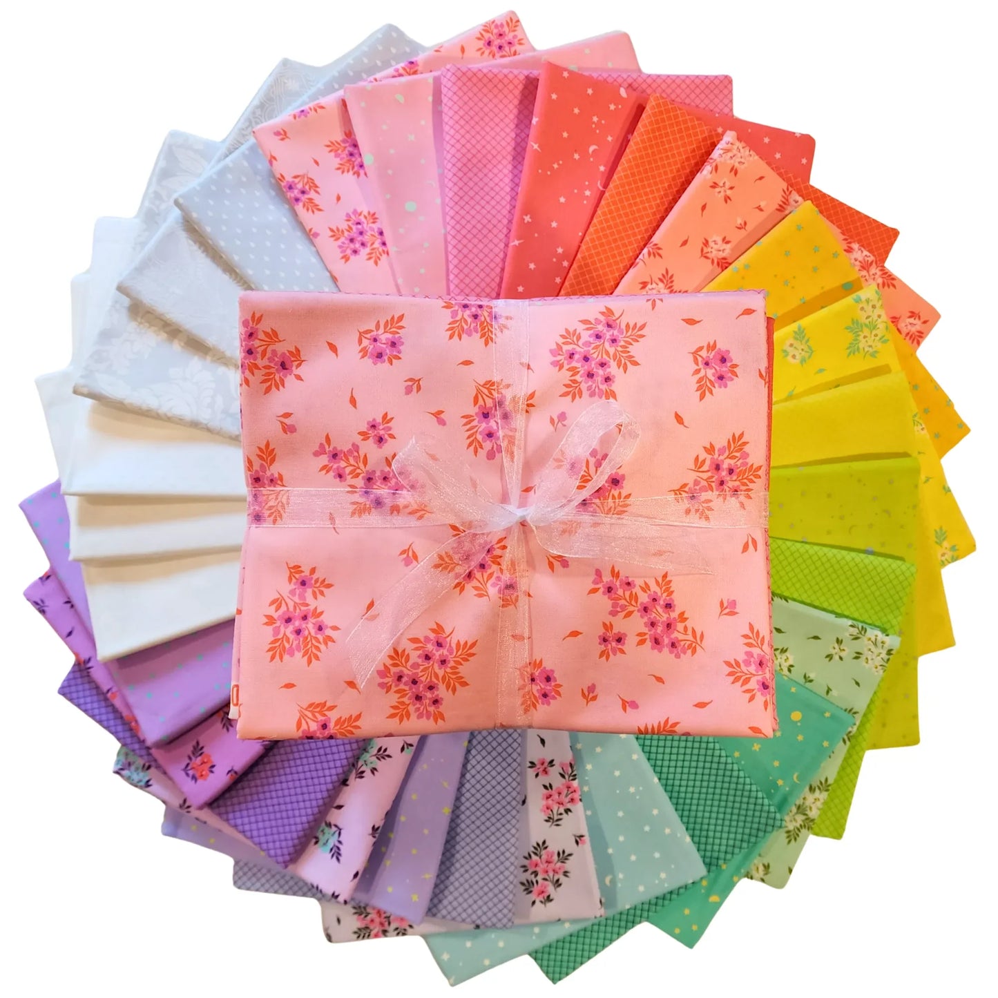 Colorful fabric swatches are arranged in a circular pattern with a one-yard bundle in the center.