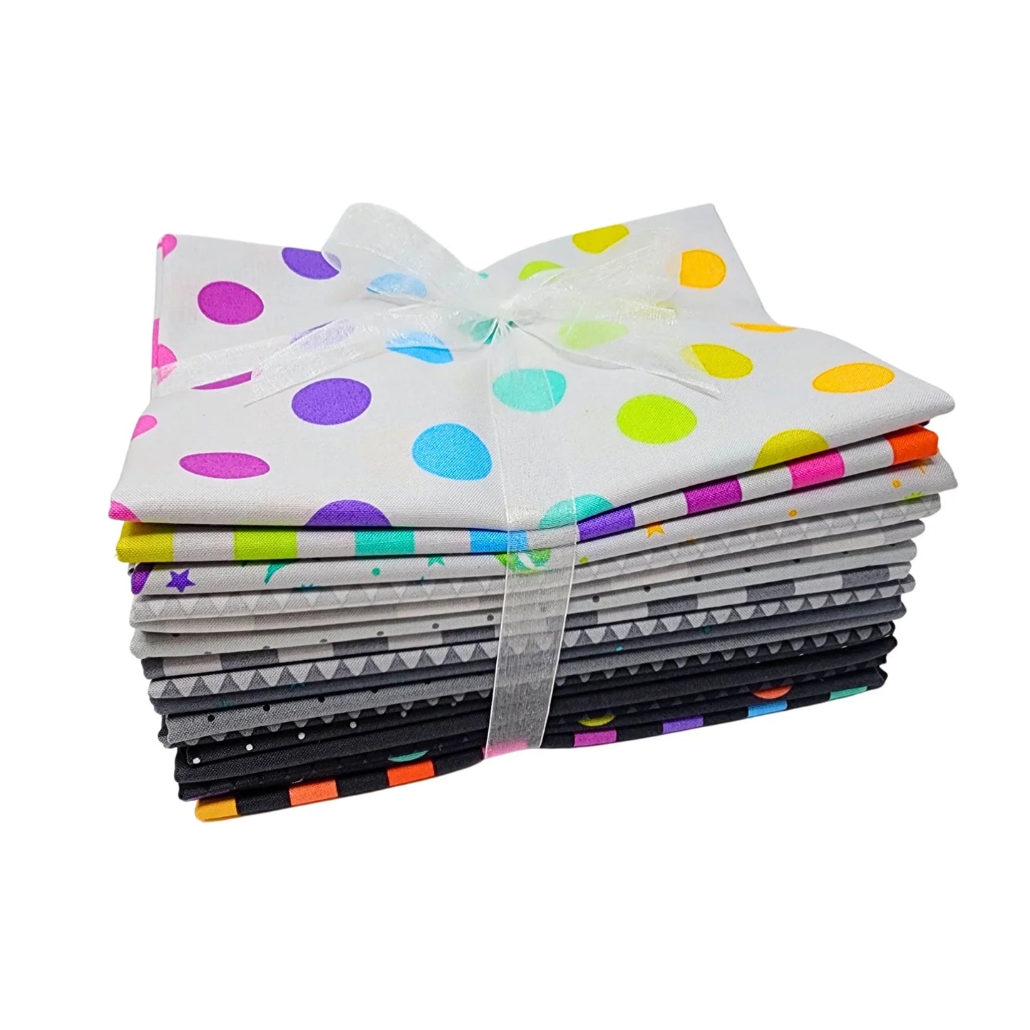 Stack of colorful grey-toned fabric squares tied with a ribbon on a white background