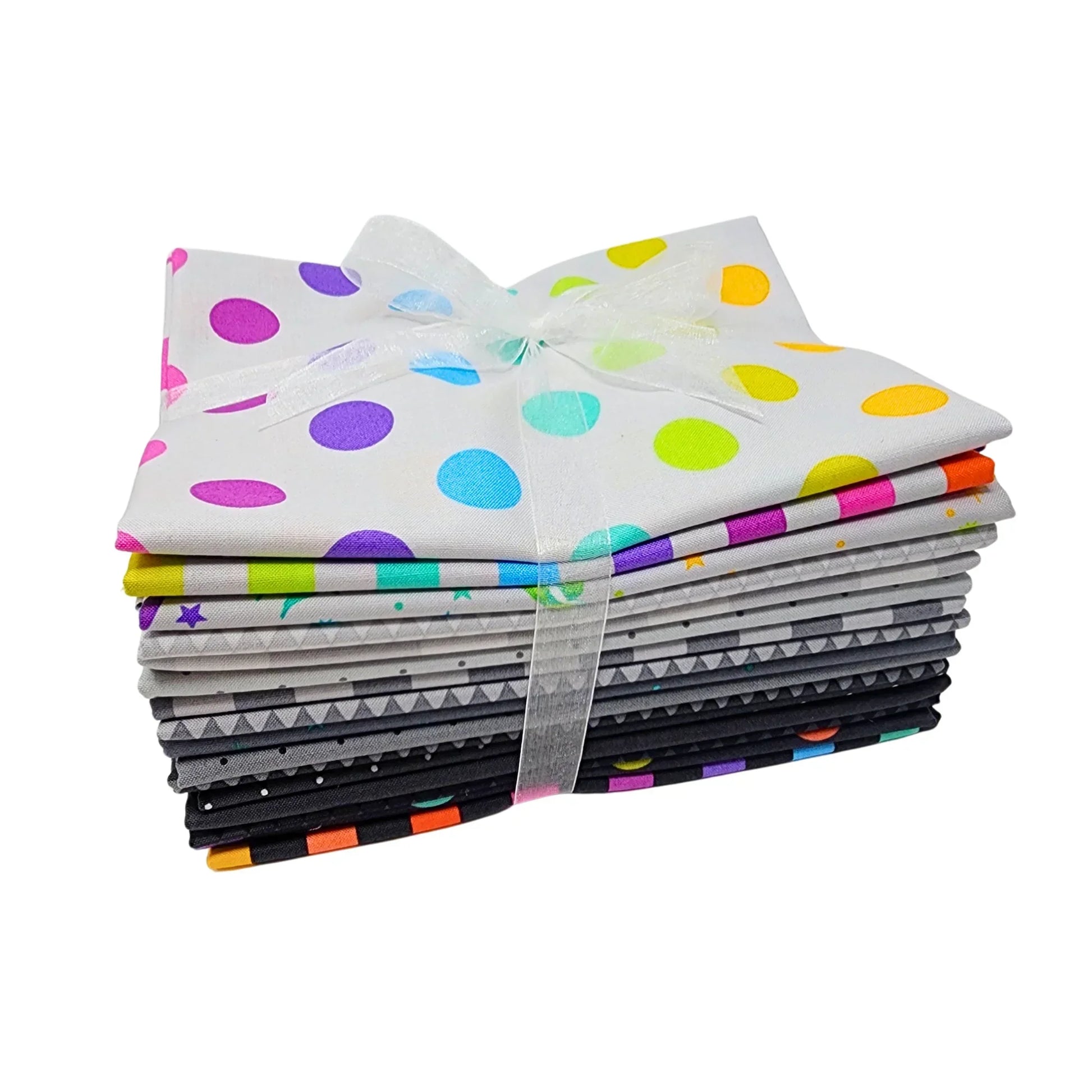 Stack of colorful grey-toned fabric squares tied with a ribbon on a white background