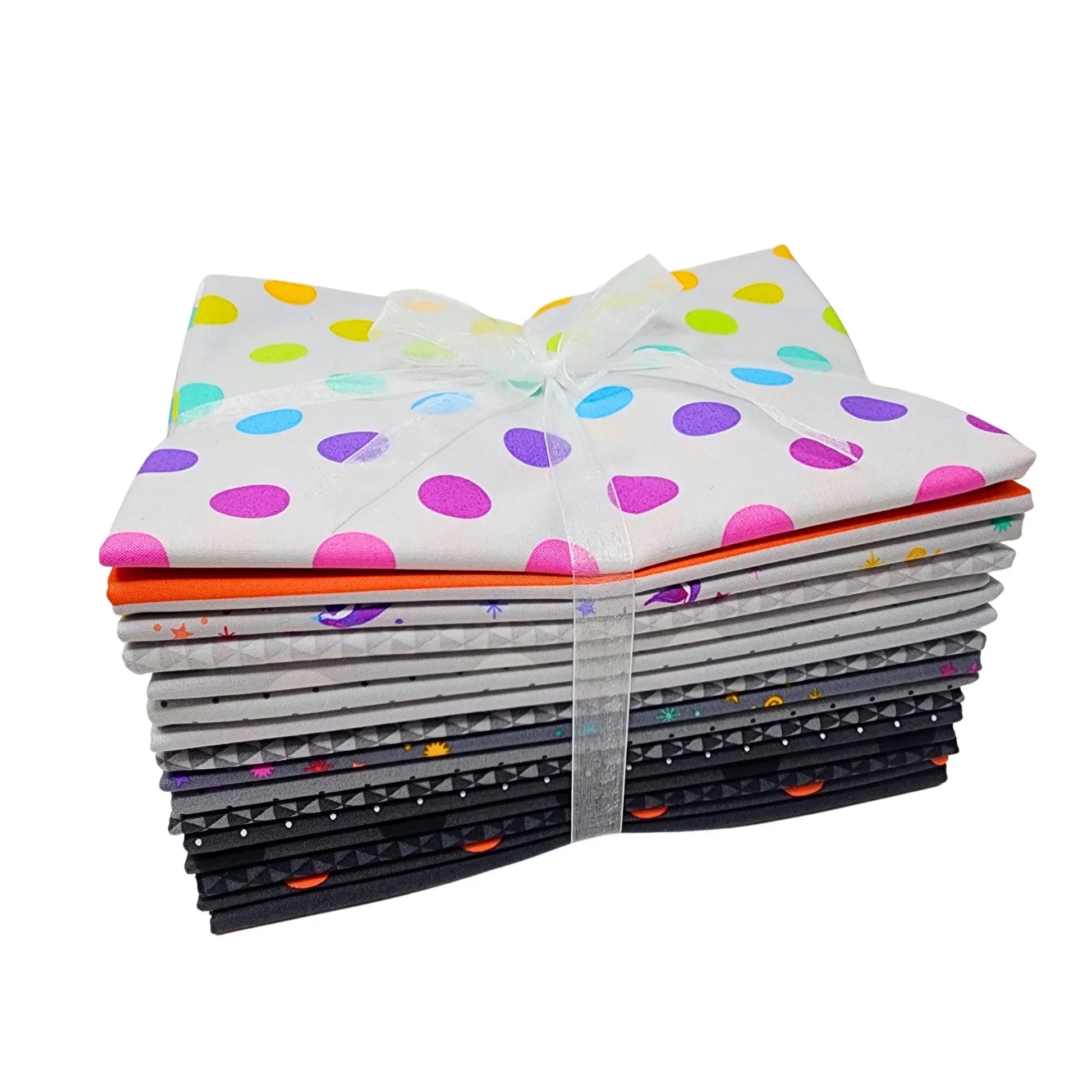 Stack of colorful grey-toned fabric squares tied with a white ribbon on a white background