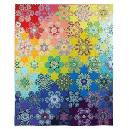 The Tula's Bloomers Quilt is an English Paper Pieced quilt using diamonds, hexagons, and pentagons to make colorful flower and star blocks. 