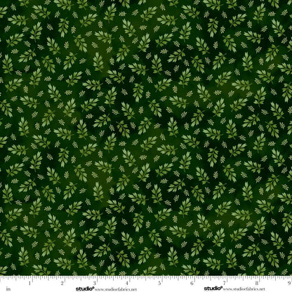 Green fabric with small leaf pattern.  Ruler at the bottom for scale.