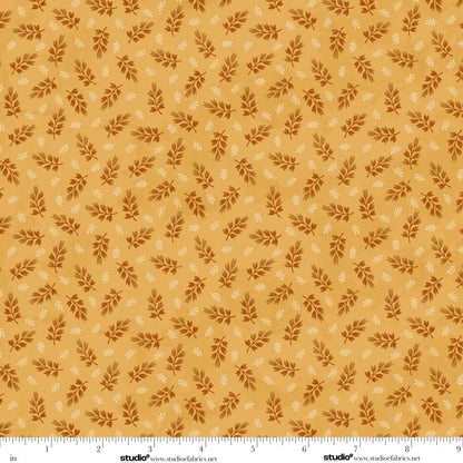 Pattern of small leaves on a golden background. Ruler at the bottom for scale.