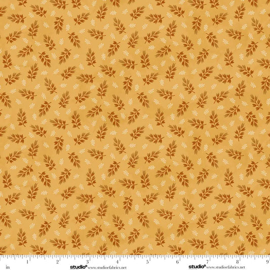 Pattern of small leaves on a golden background. Ruler at the bottom for scale.