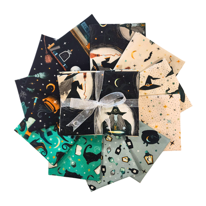 A fanned-out bundle of fabric squares in black, teal, orange, blue-grey, and beige, featuring magical and witchy motifs.