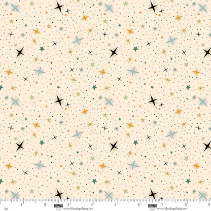 Pattern of colorful stars on a beige background with a ruler at the bottom for scale.