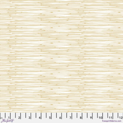 Natural Affinity Glimmer in Butterscotch features thin ivory brushstrokes on a soft golden brown background. The cream lines run parallel to the selvage edge. 